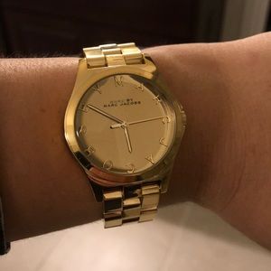 Women’s Marc by Marc Jacobs gold watch.